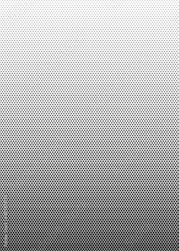 The halftone texture is black and white. Monochrome abstract, chaotic texture. Waves of dots on a white background, abstract halftone