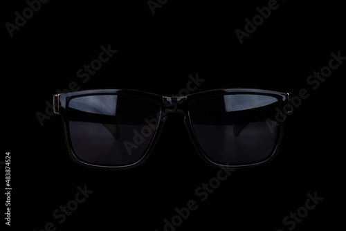 black male sunglasses isolated on black background