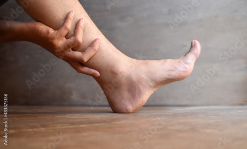 Leg of Asian man. Concept of leg pain or problem. © ZayNyi