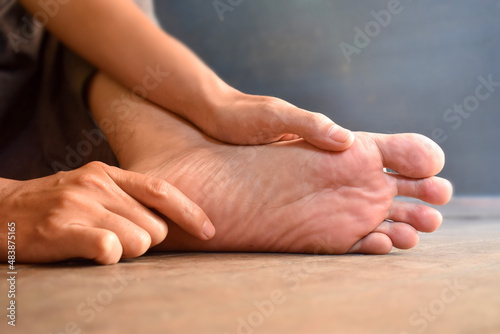 Foot of Asian man. Concept of foot care and health. photo