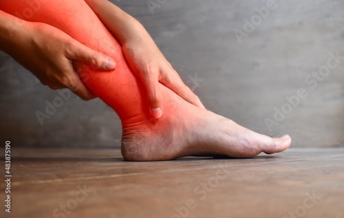 Inflammation of Asian man leg. Concept of leg pain, tetany or calf muscle tenderness. © ZayNyi