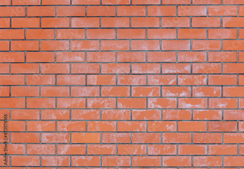 Salt on the red brick wall of the house as a background.