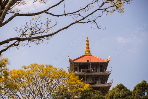 Landscape photo: Bat Nha pagoda.  Time: Saturday morning January 29, 2022. Location: Location: Bao Loc city, Lam Dong province. This is a temple with beautiful architecture and rows of blooming phoeni photo