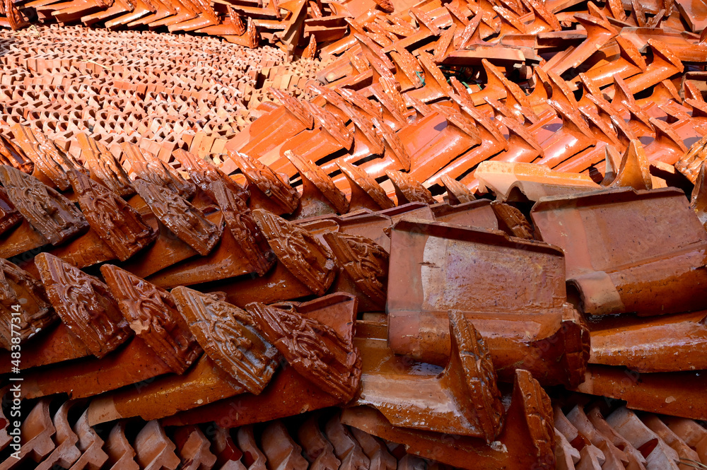 Stack of Red roof tiles for a Buddhist Temple restoration at Thailand. Stack of Red roof tiles for a Buddhist Temple restoration at Thailand.