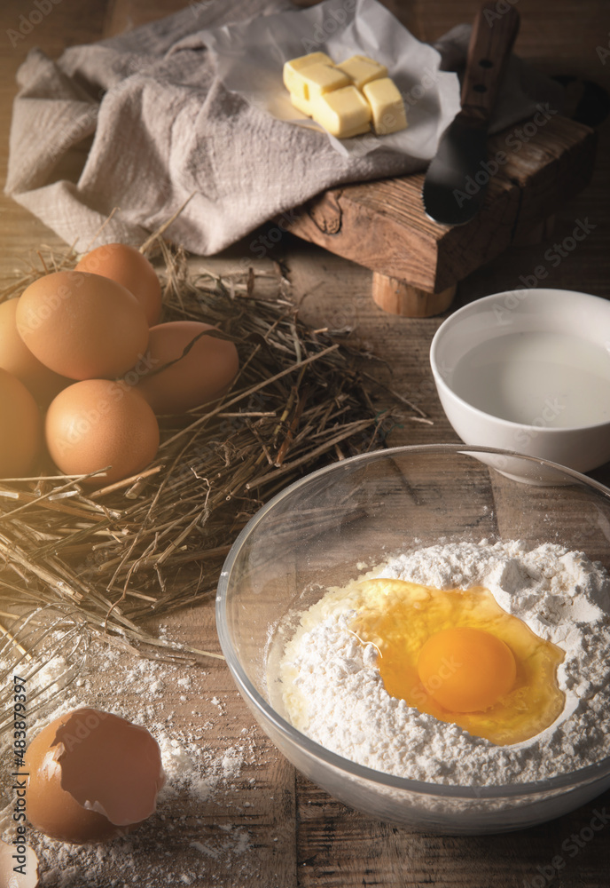 Preparing to Make Bread Using Flour and Eggs
