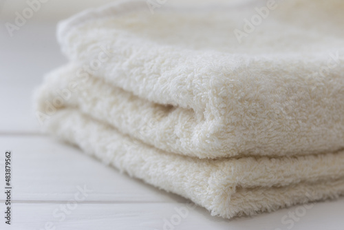 White fluffy bath towels on the white background 