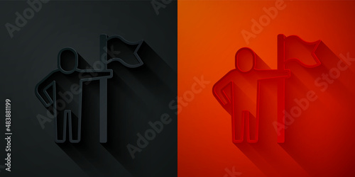 Paper cut Man holding flag icon isolated on black and red background. Victory, winning and conquer adversity concept. Paper art style. Vector