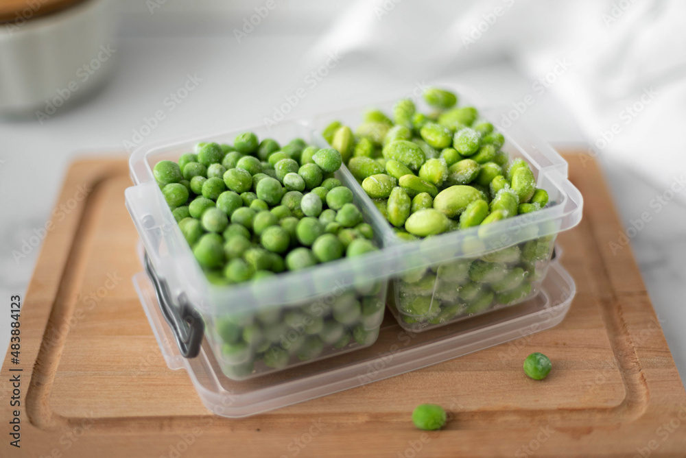 frozen green peas and beans in a plastic container frozen green peas and beans in a plastic container
