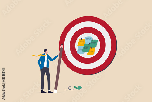 Goal setting, achievable target or purposeful objective, mission to accomplish or challenge to win for business success concept, businessman write down goal on notes and put on big dartboard target.
