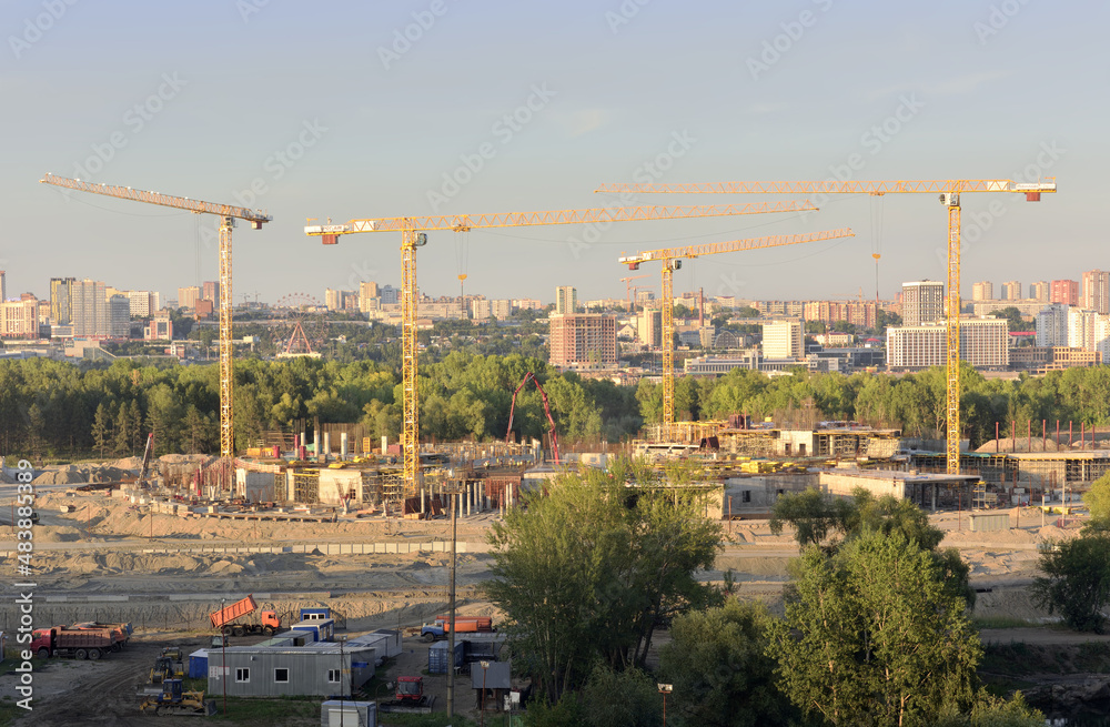 Construction cranes in the panorama of Novosibirsk
