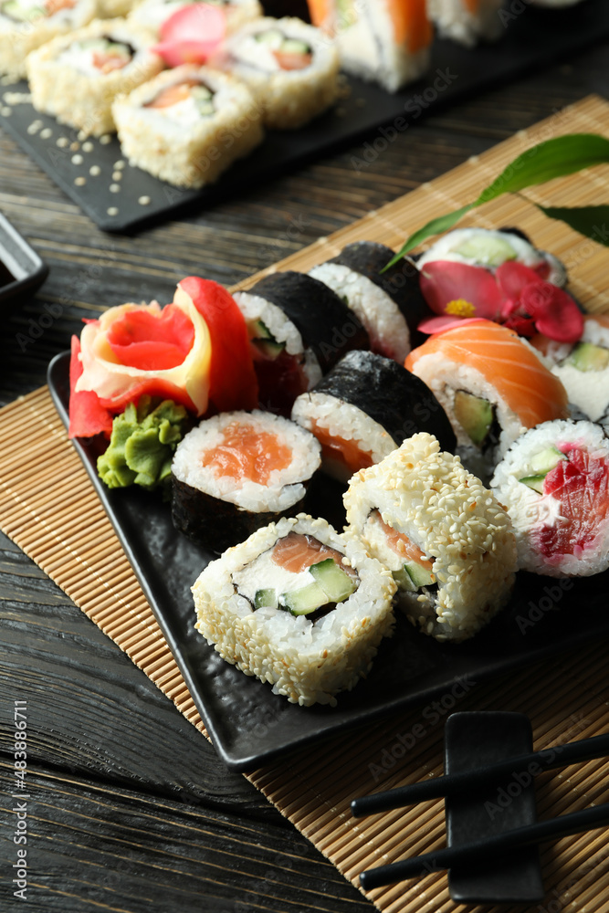 Concept of tasty food with sushi rolls, close up Concept of tasty food with sushi rolls, close up