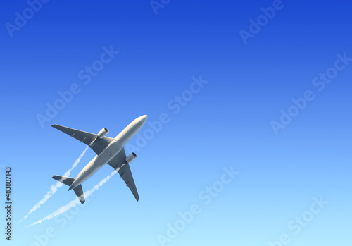 Horizontal nature background with aircraft and Jet trailing smoke in the sky. Airplane and condensation trail