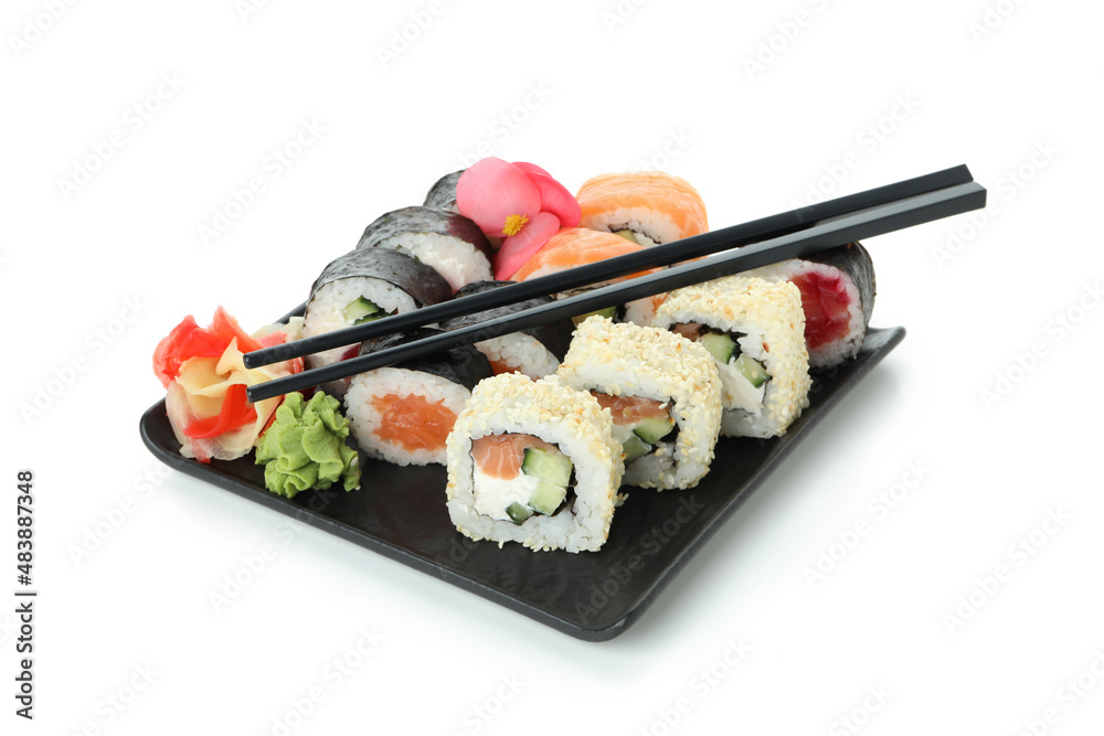 Fototapeta premium Plate with sushi rolls isolated on white background