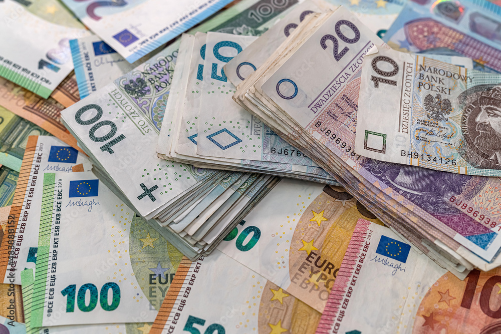 heap pile of euro bills with polish zloty as finance background heap pile of euro bills with polish zloty as finance background