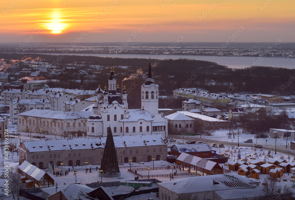 Fototapeta premium Winter sunset over the lower city. The bank of the Irtysh, the Church of Zacharias