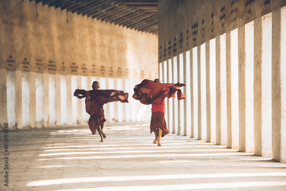  Children monks spending time together. In myanmar childrens start the training to become monks at the age of seven - obrazy, fototapety, plakaty 