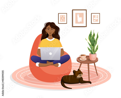 Woman is sitting on a bean bag chair at home at a laptop computer. Remote work, office at home, programming, freelance. Study at home in quarantine. Vector illustration. Cozy interior with a cat.