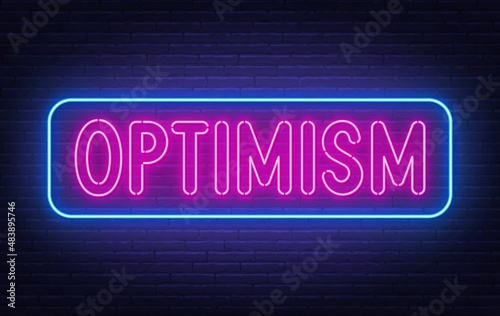 Neon sign Optimism on brick wall background.