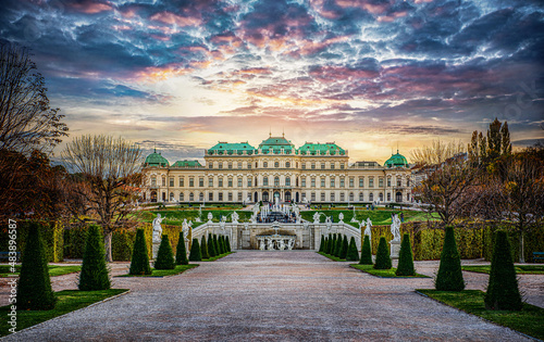 Panoramic evening view of the famous Belvedere Castle in Vienna, Austria. View of the fountain, park and Belvedere in the autumn evening. photo