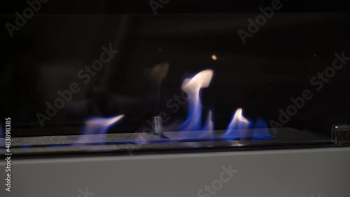 Biofireplace burn on ethanol gas. Modern smart ecological alternative technologies. Modern bio fireplot fireplace on ethanol gas. Burning bio fireplace. Close up of flame. photo