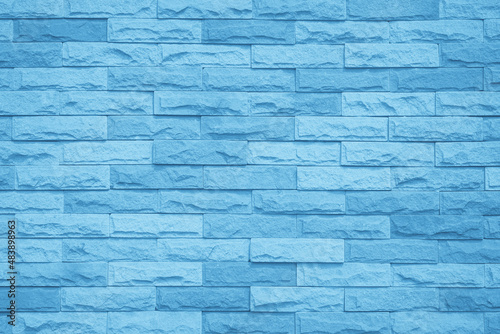 Brick wall painted with blue dark paint pastel calm tone texture background. 