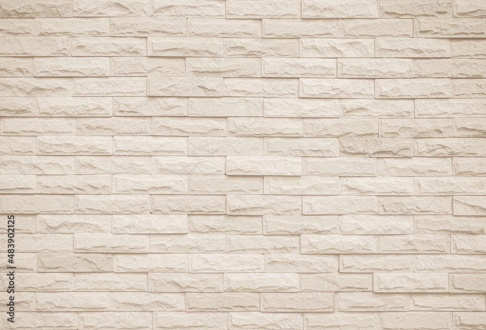 Cream and white brick wall texture background. Brickwork and stonework flooring interior rock old pattern