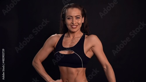 Attractive girl with an atlantic physique smiles and poses for the camera.