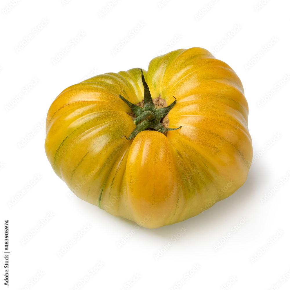 Single yellow coeur de boeuf tomato isolated on white background Single yellow coeur de boeuf tomato isolated on white background