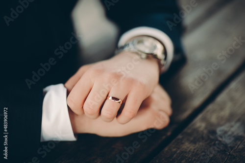 hands of the groom