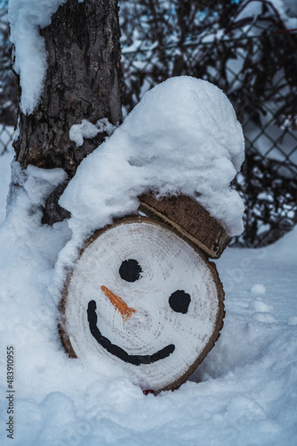 handmade snowman drowning in snow