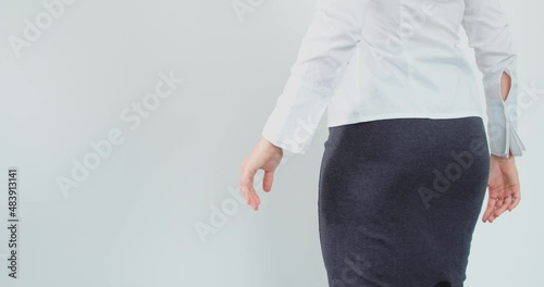 Woman getting slap on her ass, gets angry and push man away. Sexual harassment concept. Back static view