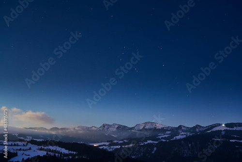 cold winter landscape in evening light in the Allgaeu Alps near Oberstaufen, Bavaria, Germany