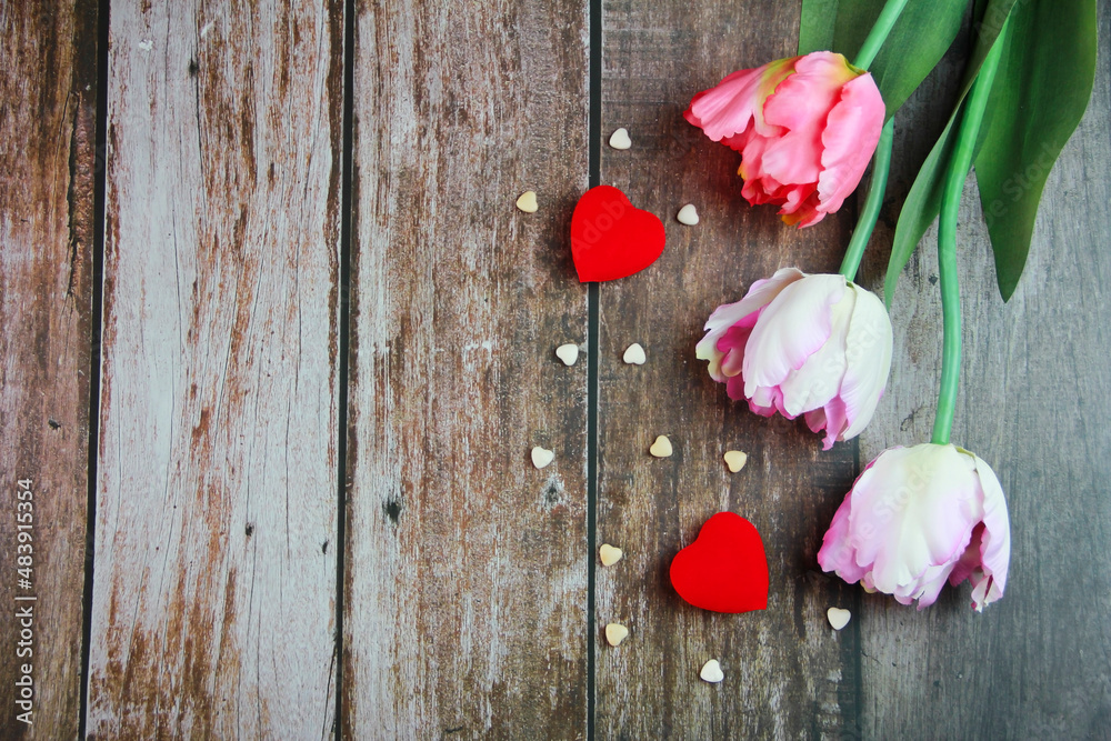 pink tulips and red heart on wooden background pink tulips and red heart on wooden background