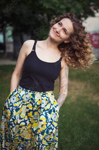 Portrait of curly-haired woman on the street