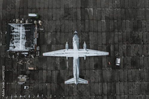A snow-covered plane at the airport