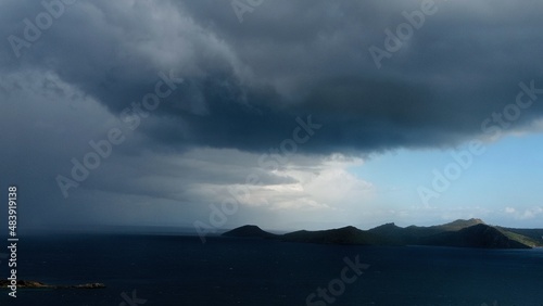 dark clouds gather over the sea © sherifali