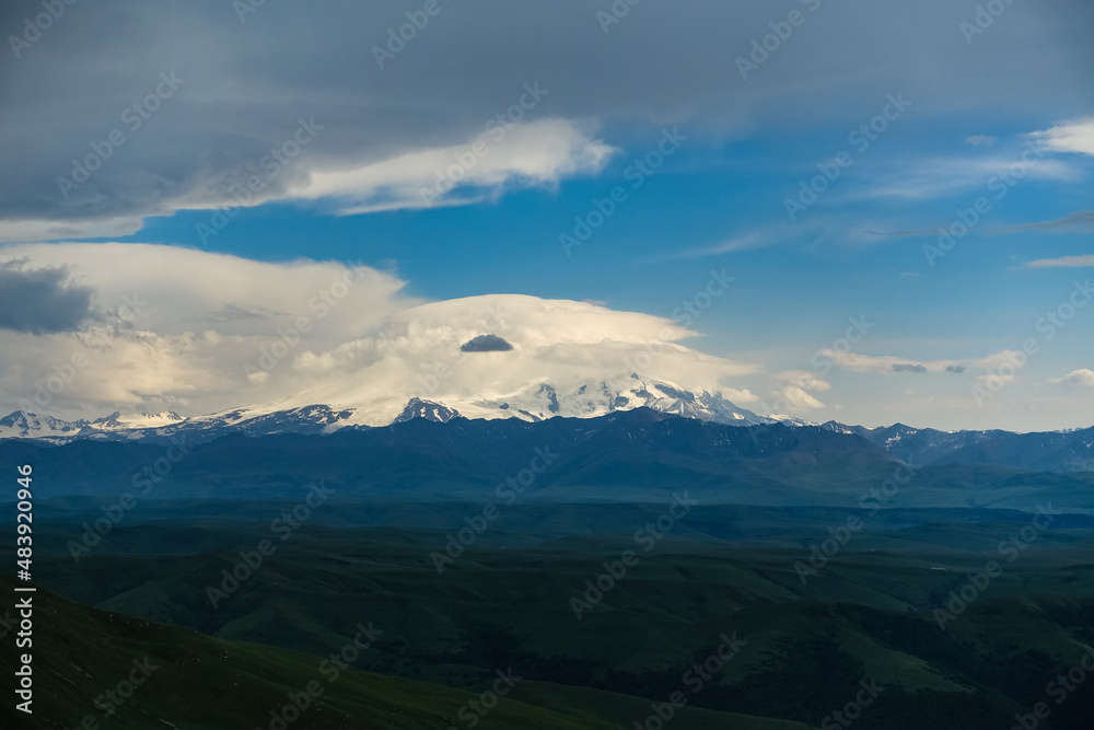 View of Elbrus and the Bermamyt plateau in the Karachay-Cherkess Republic, Russia. The Caucasus Mountains.