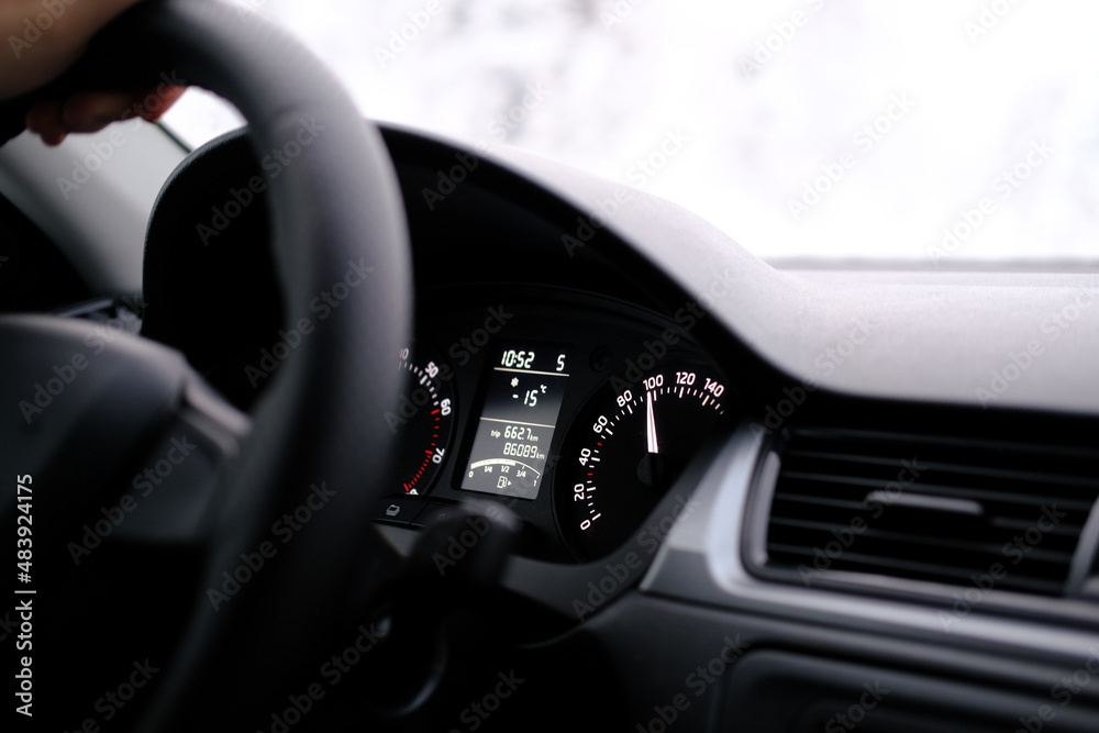 Car speedometer close up. Speedometer arrows in dark colors.