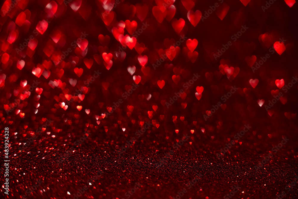 Red hearts, sparkling glitter bokeh background, valentines day abstract defocused texture Red hearts, sparkling glitter bokeh background, valentines day abstract defocused texture