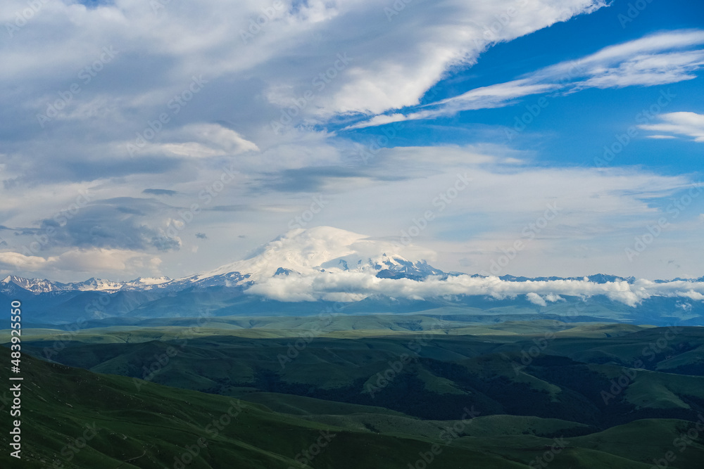 View of Elbrus and the Bermamyt plateau in the Karachay-Cherkess Republic, Russia. The Caucasus Mountains.