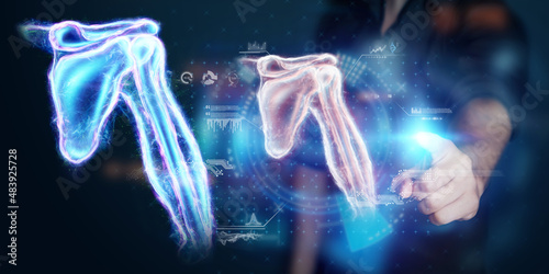 Medical poster, human body anatomy, shoulder joint x-ray, bones hologram. The doctor looks at the patient's x-ray hologram. Surgery, modern medicine, technology.