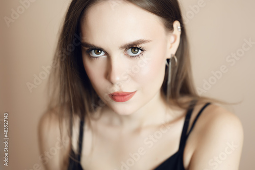 Portrait of a beautiful young woman with brown eyes.