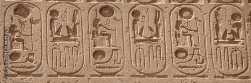 Relief details and Egyptian hieroglyphs at Karnak temple complex in Luxor photo
