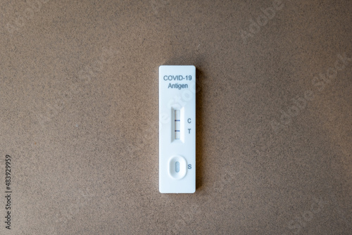 Covid 19 antigen rapid test kit with positive result for infection. Coronavirus rapid self-test home kit close-up image