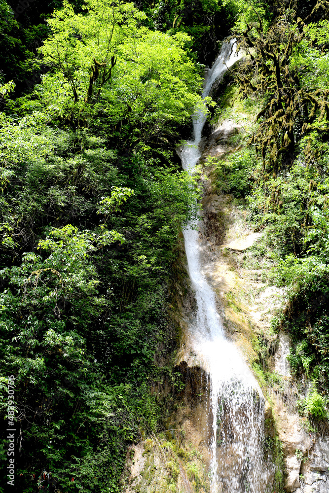 Abkhazia.May 27, 2021.Enchanting view of mountains and waterfall Women's tears. Abkhazia.May 27, 2021.Enchanting view of mountains and waterfall Women's tears.