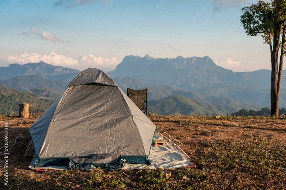 Tent camping on hill with mountain range in national park