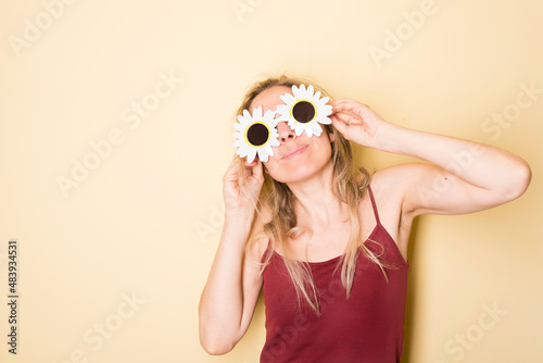 Happy woman in yellow background
