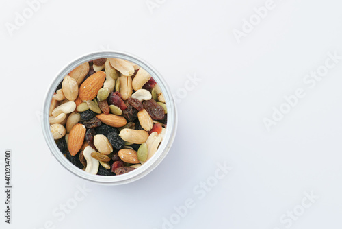 close up of many mixed nuts in a container with copy space 