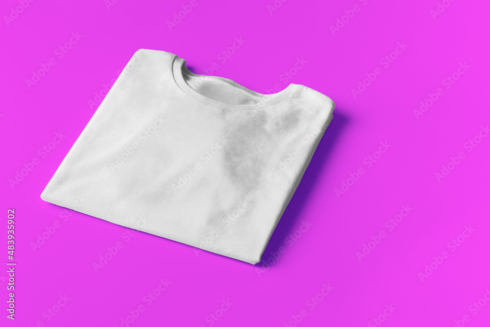 Basic white Tshirt on magenta background. Mock up for branding t-shirt with copyspace. Basic white Tshirt on magenta background. Mock up for branding t-shirt with copyspace.