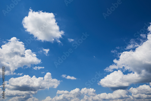 White cumulus clouds in blue sky, beautiful cloudscape background © Lazy_Bear